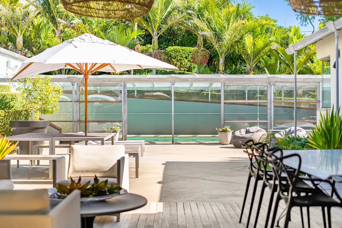 Sheltered terrace connecting indoor and outdoor spaces